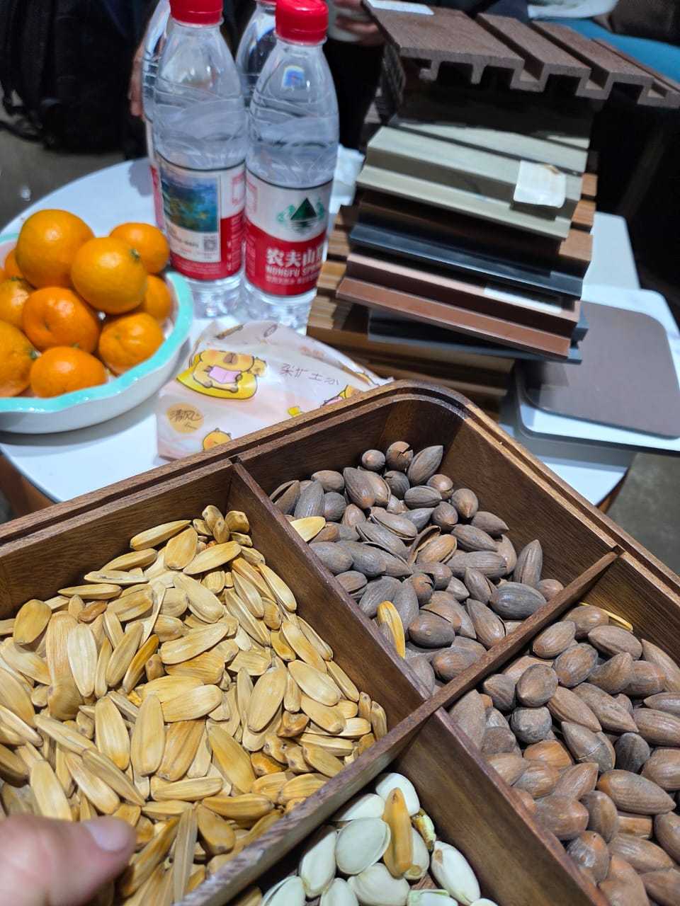meeting table with material samples and snacks